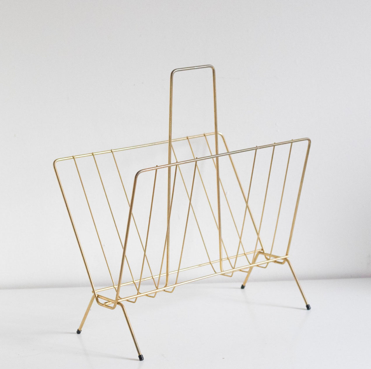 Vintage magazine holder in gold metal