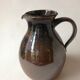 Glazed stoneware jug signed "KD".