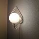 Metal applique with 80s glass sphere