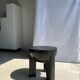 Black mango wood tripod side table with a semi-spherical top, height: 45 cm, diameter: 44 cm.