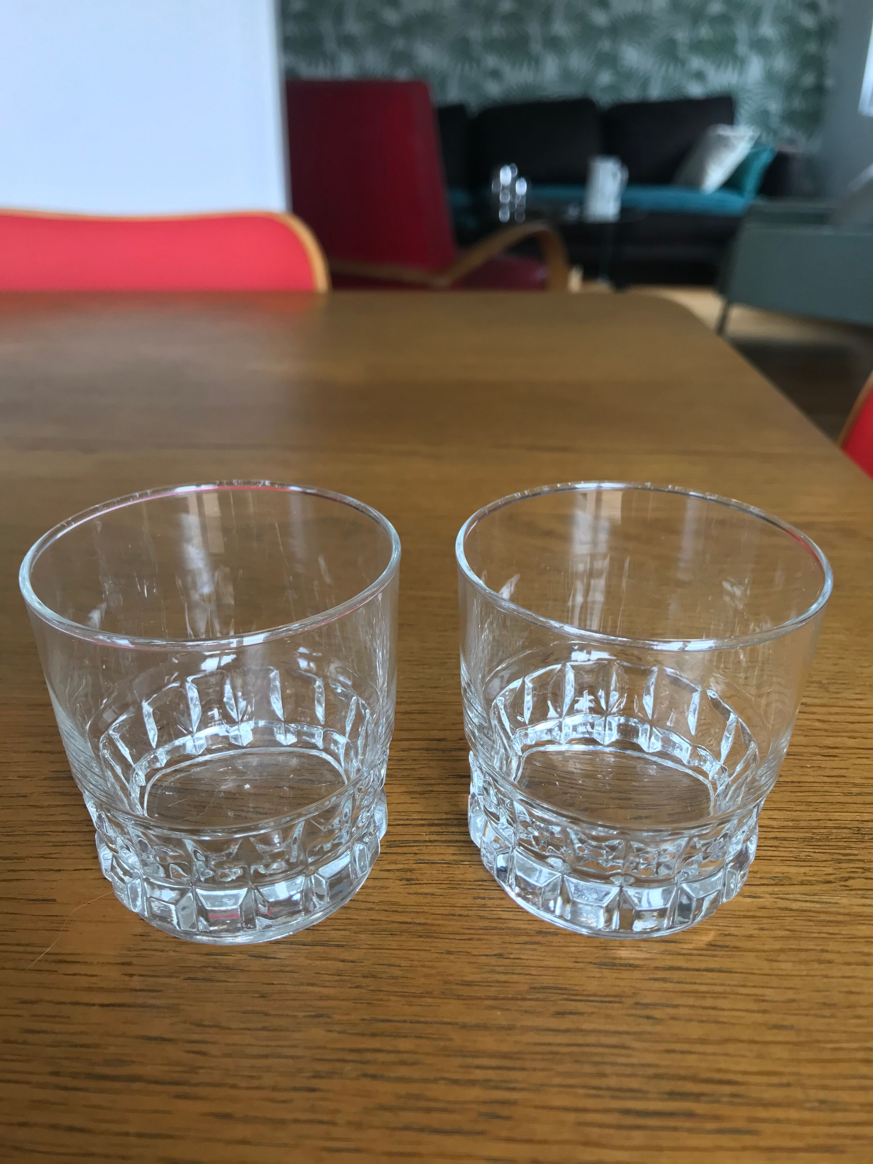 Mismatched decanter and whiskey glasses