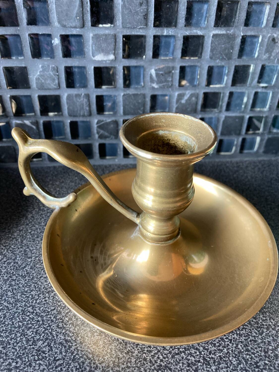 Two brass hand candle holders