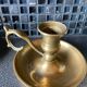 Two brass hand candle holders