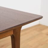 Extendable teak dining table in Mid-Century style from McIntosh, UK.