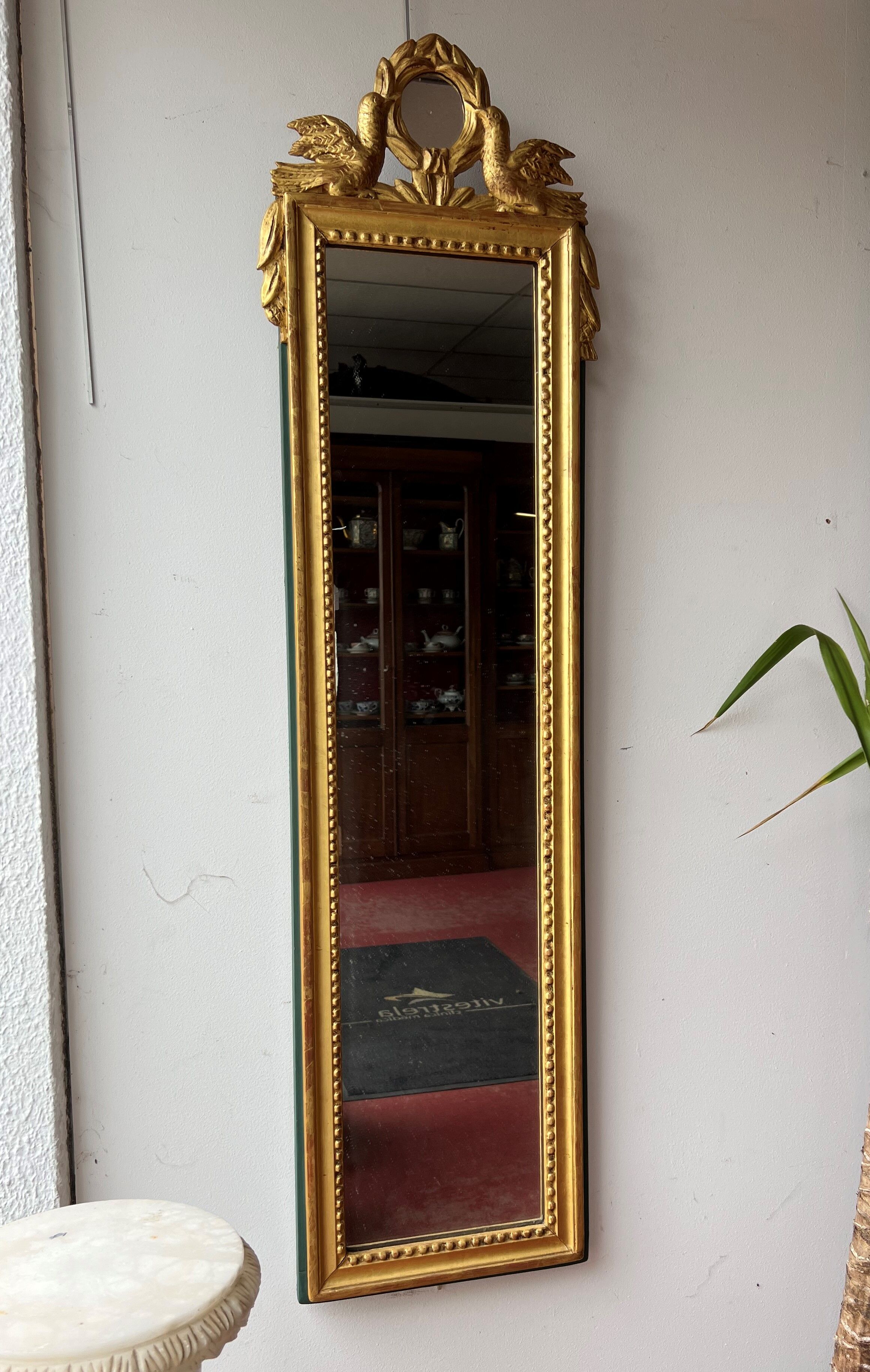 Mirror between two Louis XVI style in gilded wood with leaf around 1900