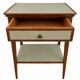 Small vintage table in sage green wood.