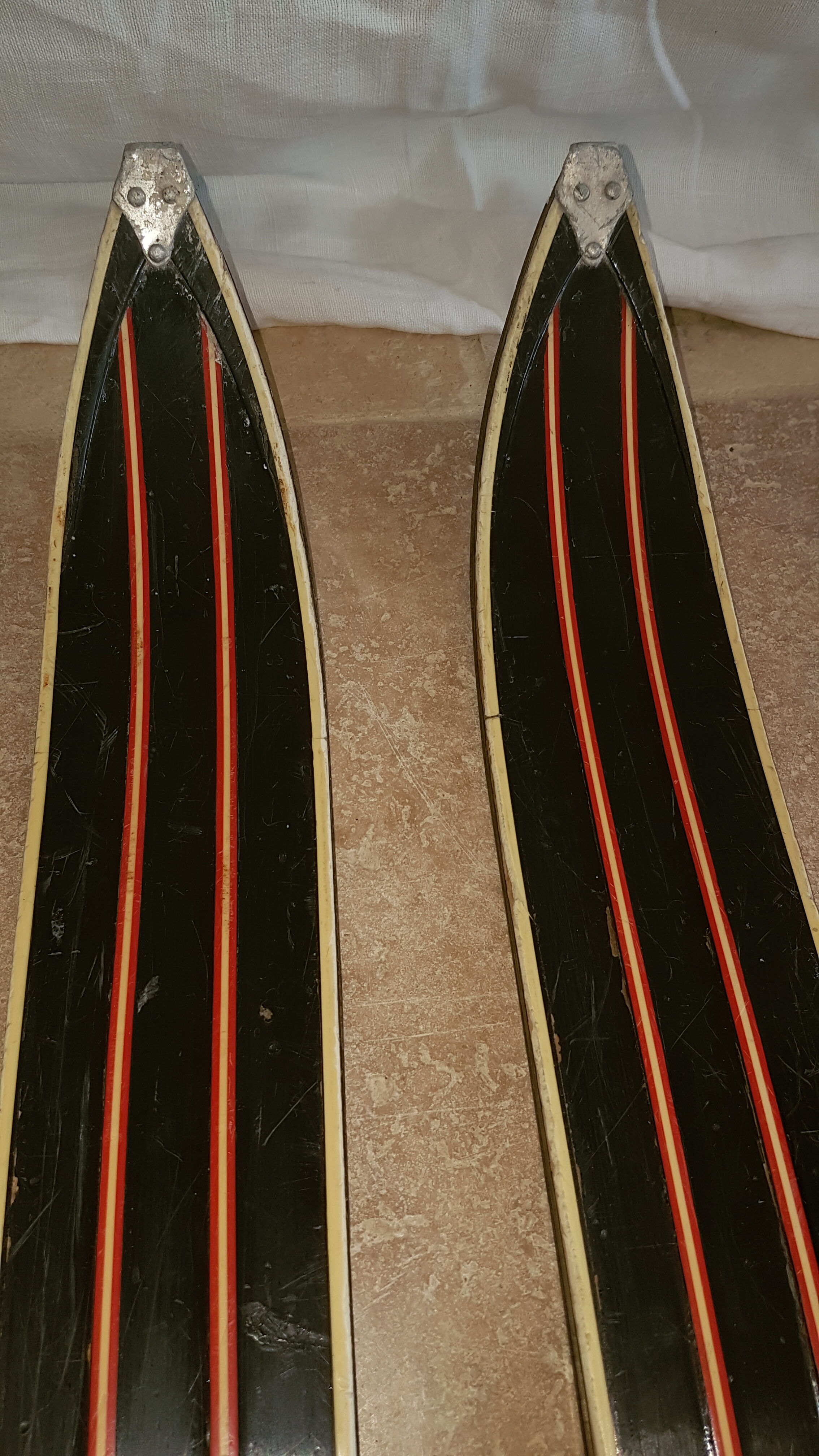 Old skis wooden and its pair of sticks