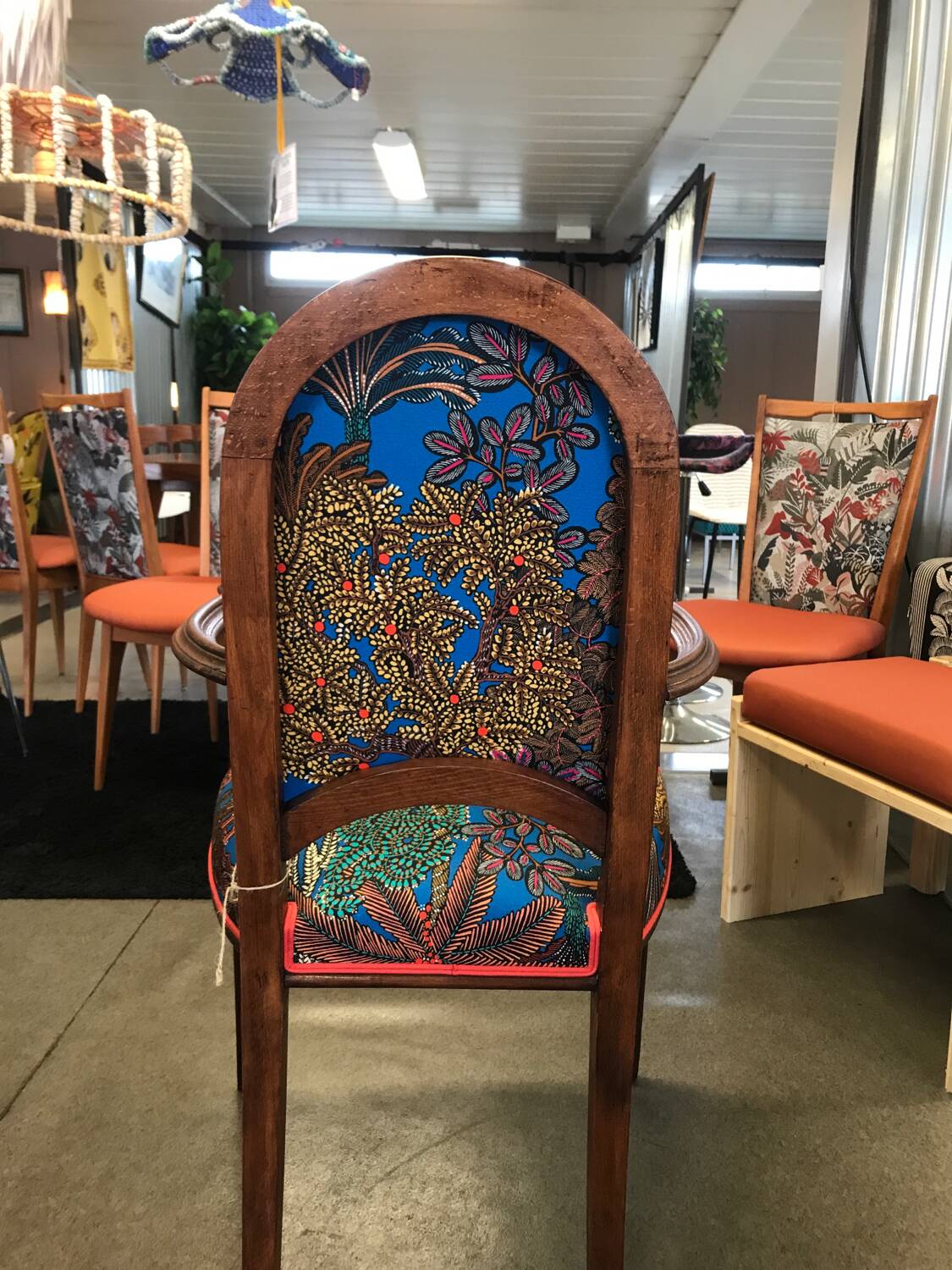 Art Nouveau armchair with a floral seat and backrest.