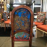 Art Nouveau armchair with a floral seat and backrest.
