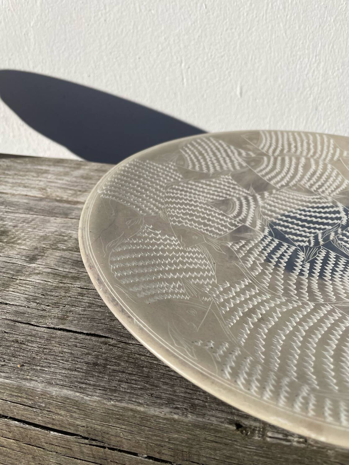 Ethnic handmade round fish dish