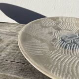 Round ethnic handmade fish dish