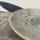 Ethnic handmade round fish dish