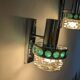 Pair of Space Age wall lights in chrome and green glass, 1970s.