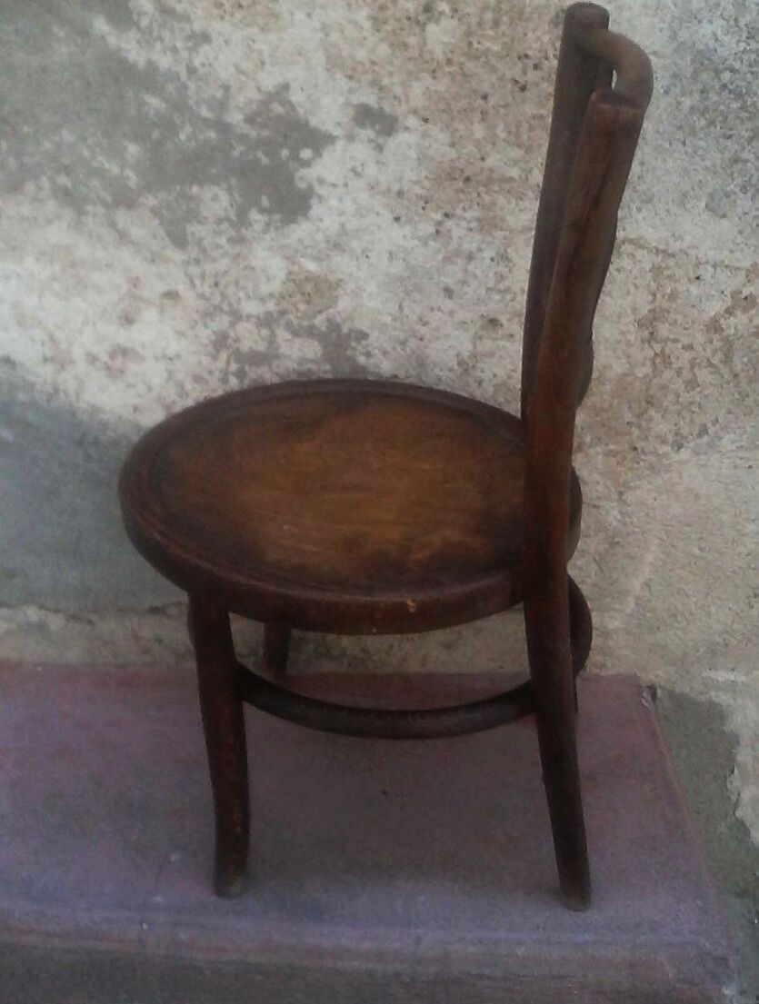 Antique children's chair in curved wood