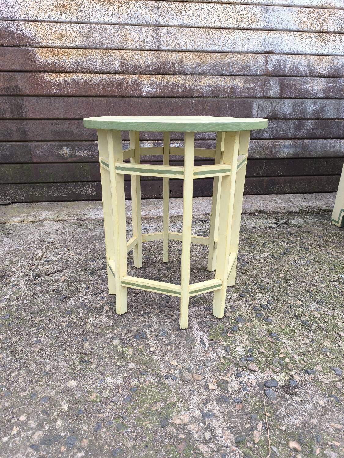 Yellow and green patinated pedestal table by a local artist