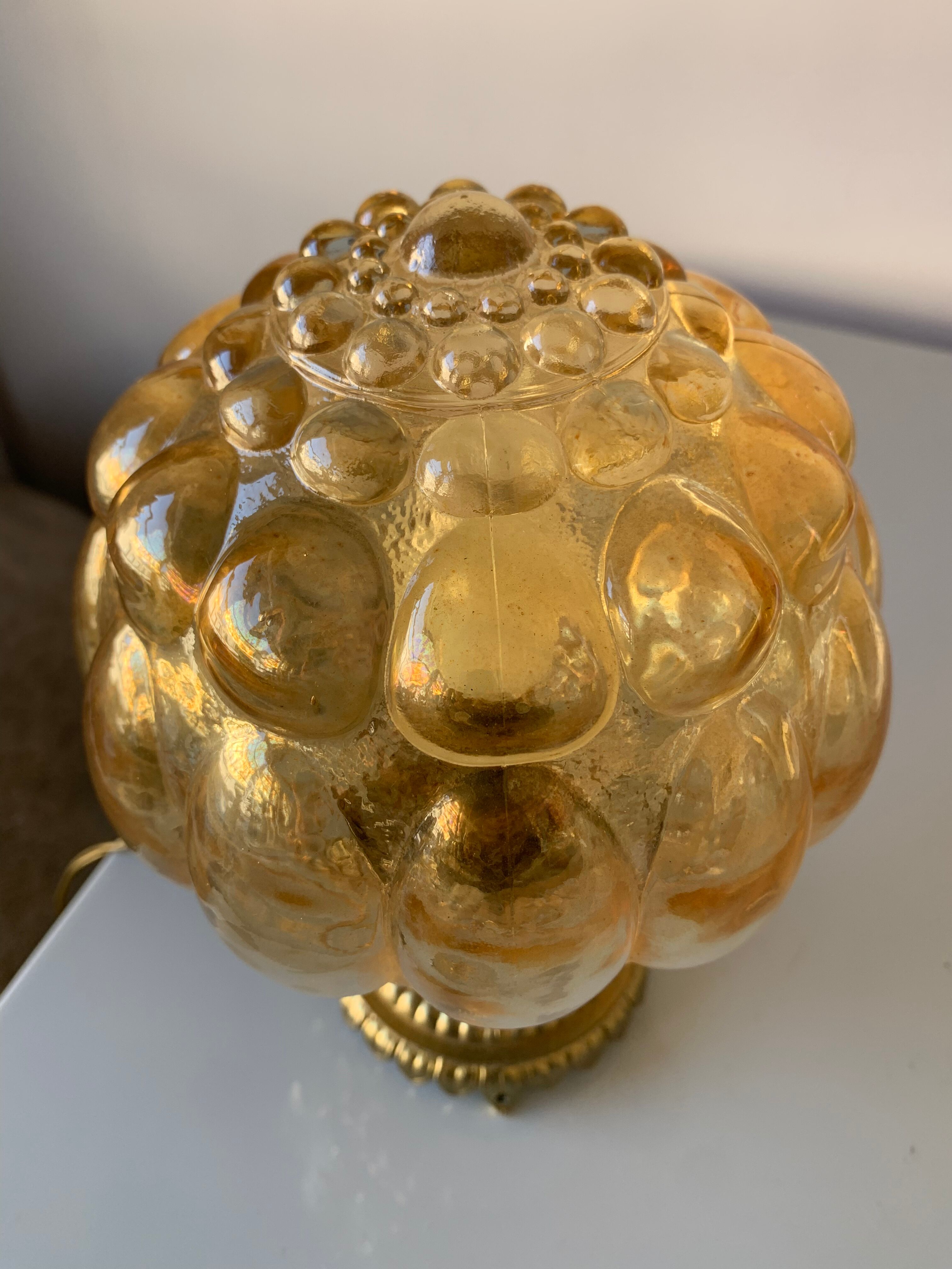 Old vintage table lamp made of amber molded glass