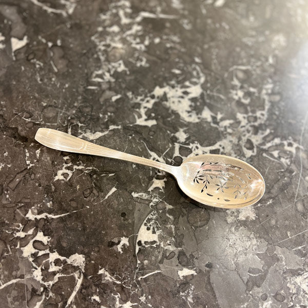 Openwork serving spoon, silver metal