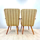 A pair vintage cocktail chairs with stripes and metal screws