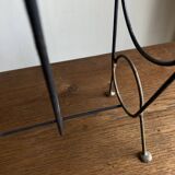 Mid-century poetic magazine rack in black metal