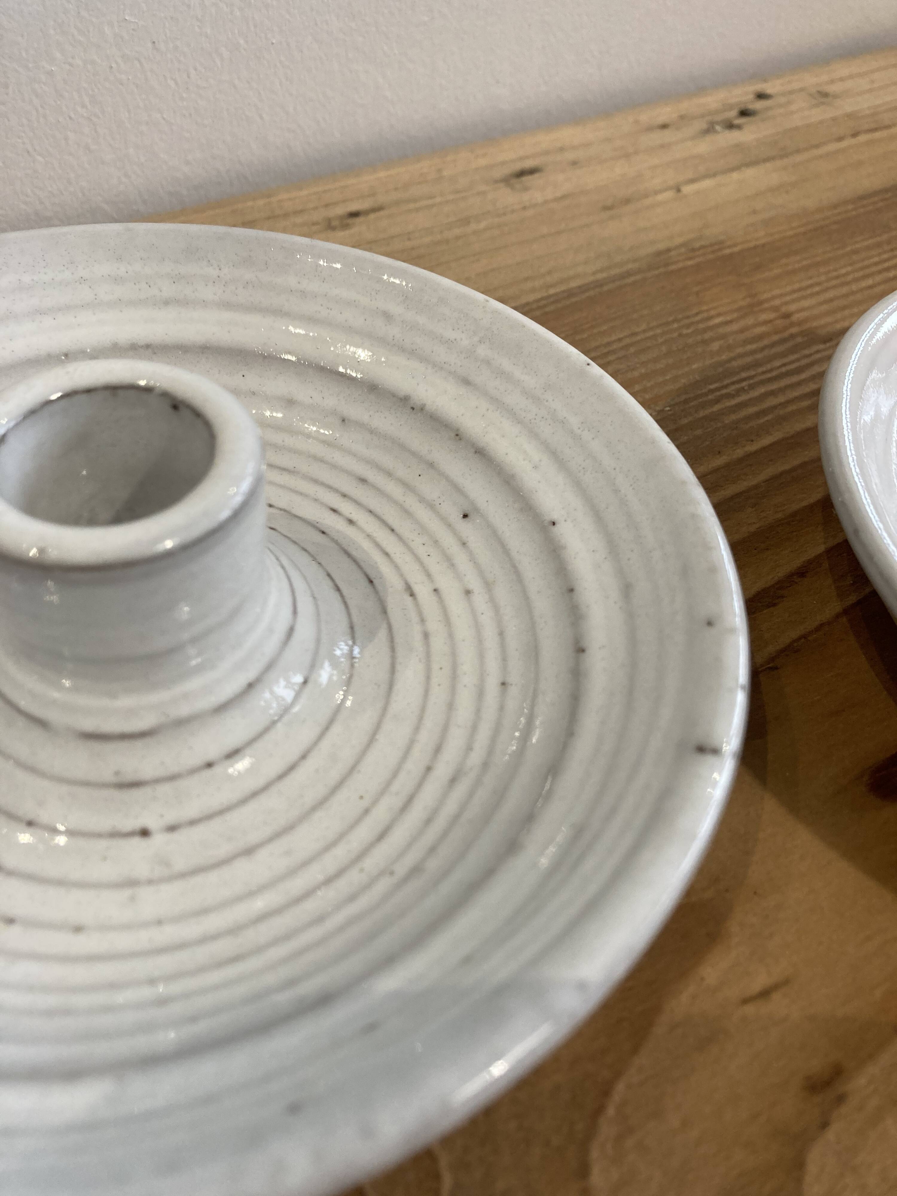 Pair of enamelled ceramic candlesticks