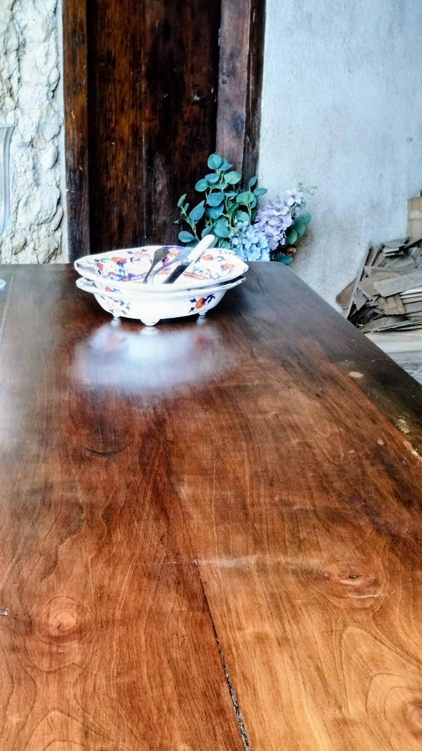 Old French farmhouse table in walnut with turned legs.
