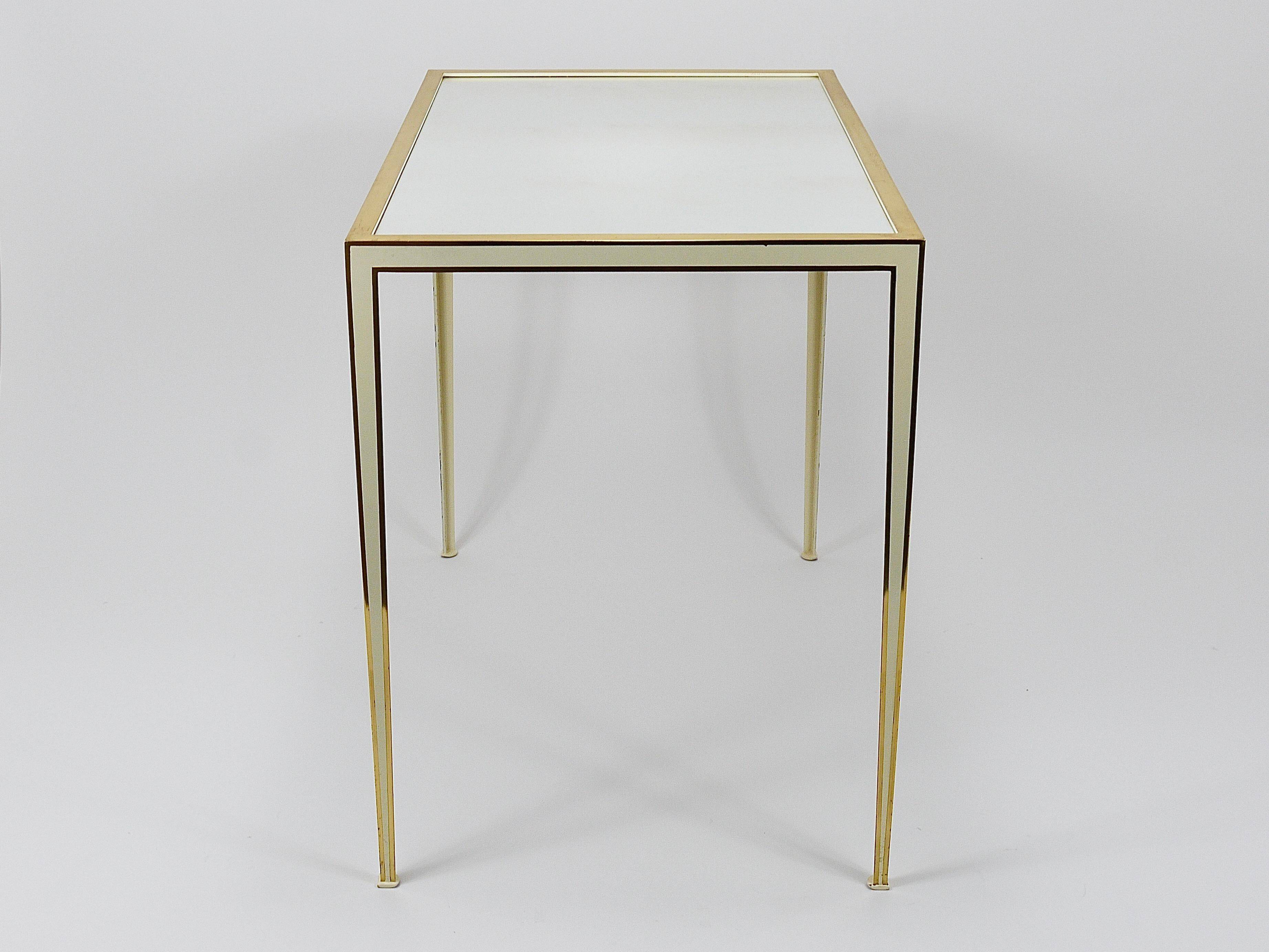 A pair of brass and white mirror tables from Vereinigte Werkstätten, Germany, 1970s.