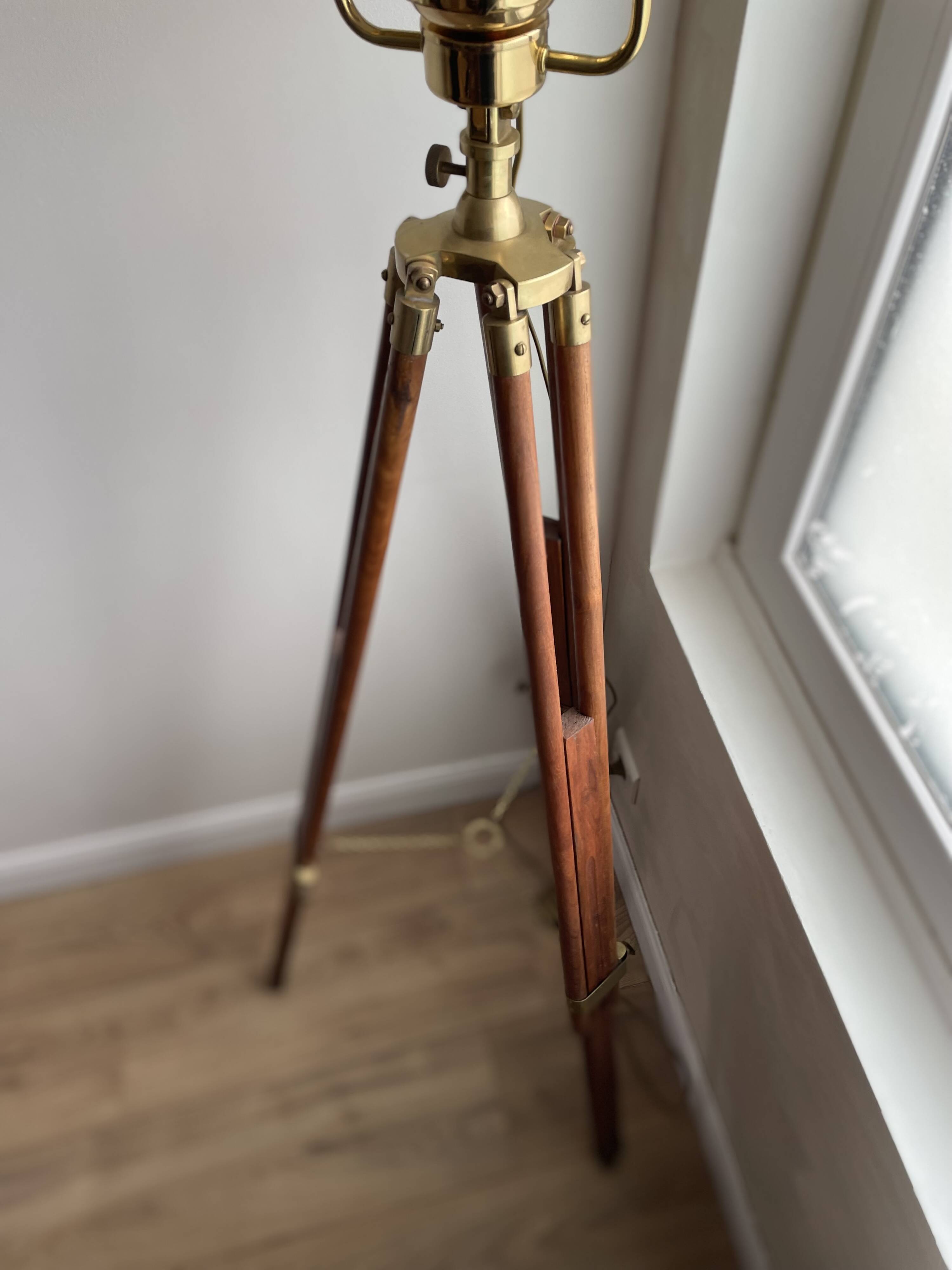 Vintage wooden and brass tripod lamp in marine style.