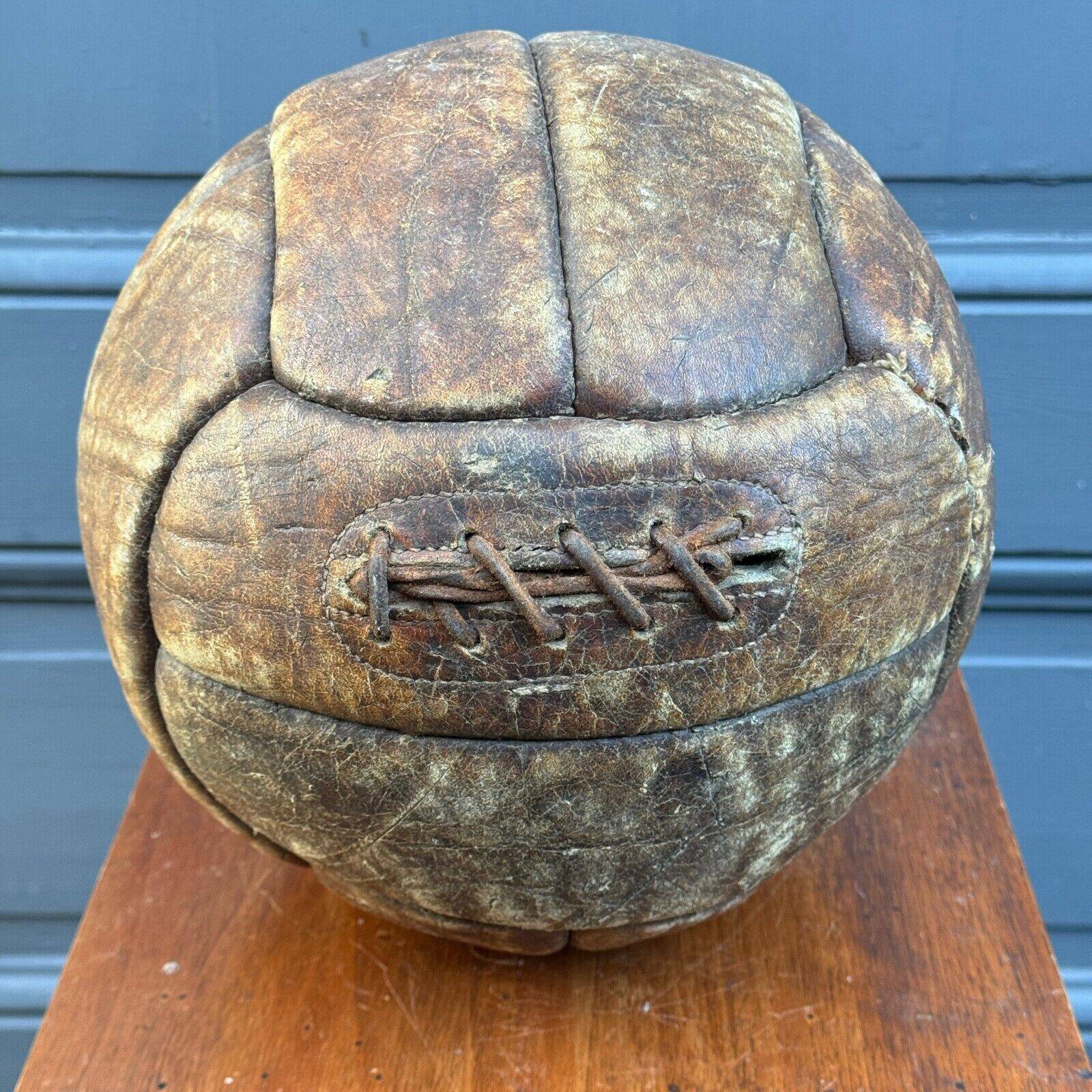 Mid-20th century leather soccer ball with visible stitching and beautiful patina