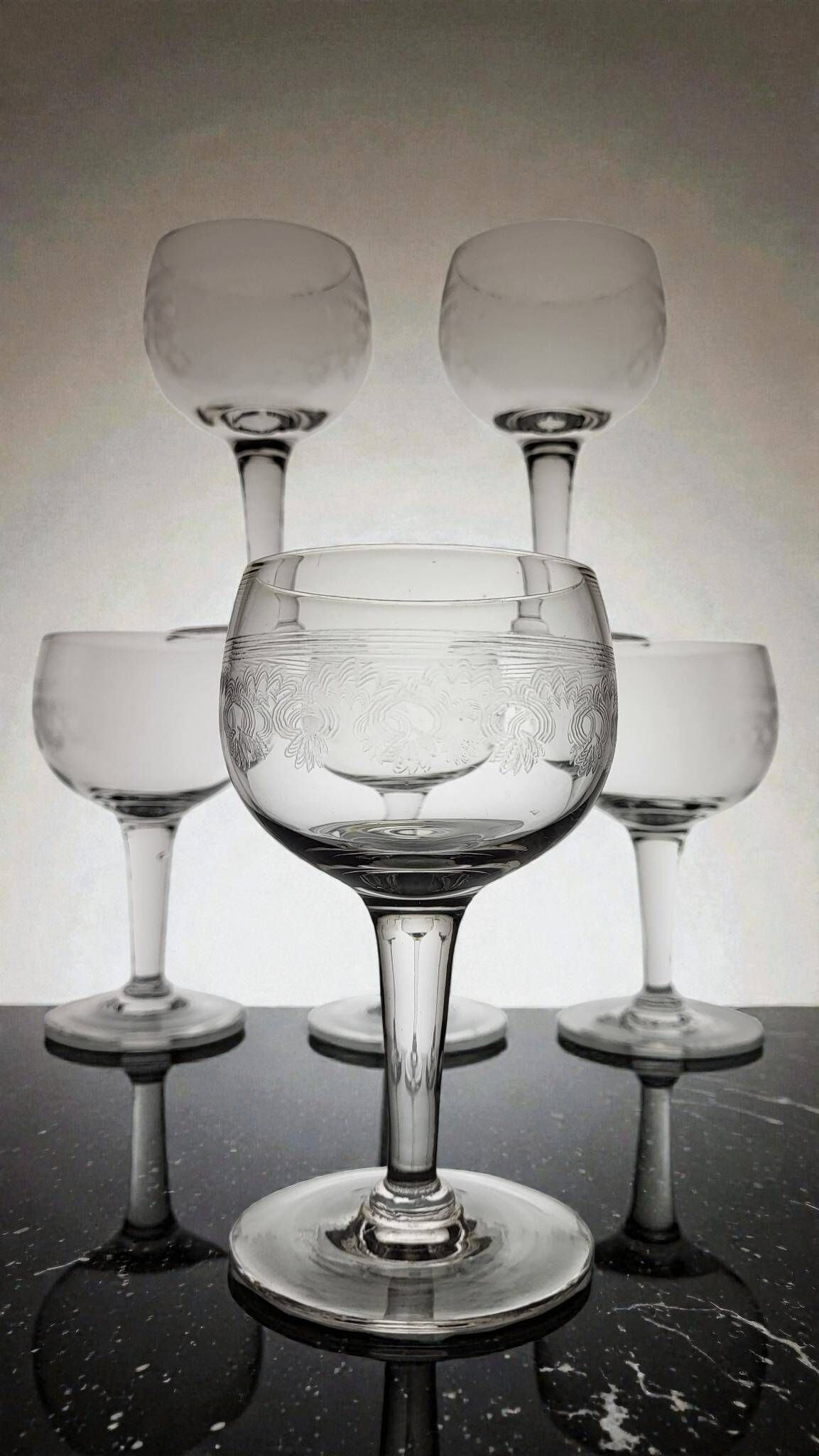 9 guilloché wine glasses, early 20th century.