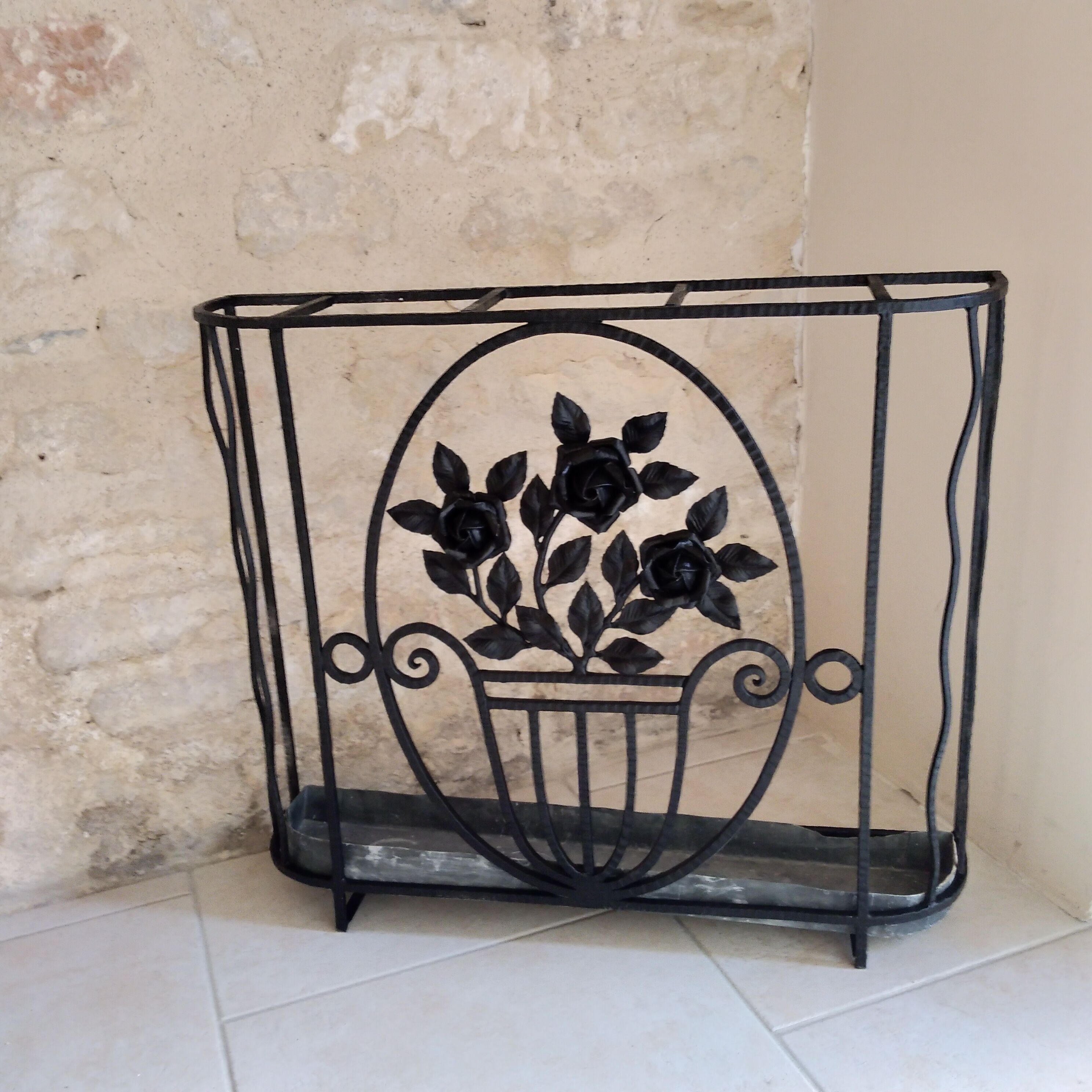 Art deco wrought iron coat holder