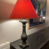 Lamp with red hat and cast iron base