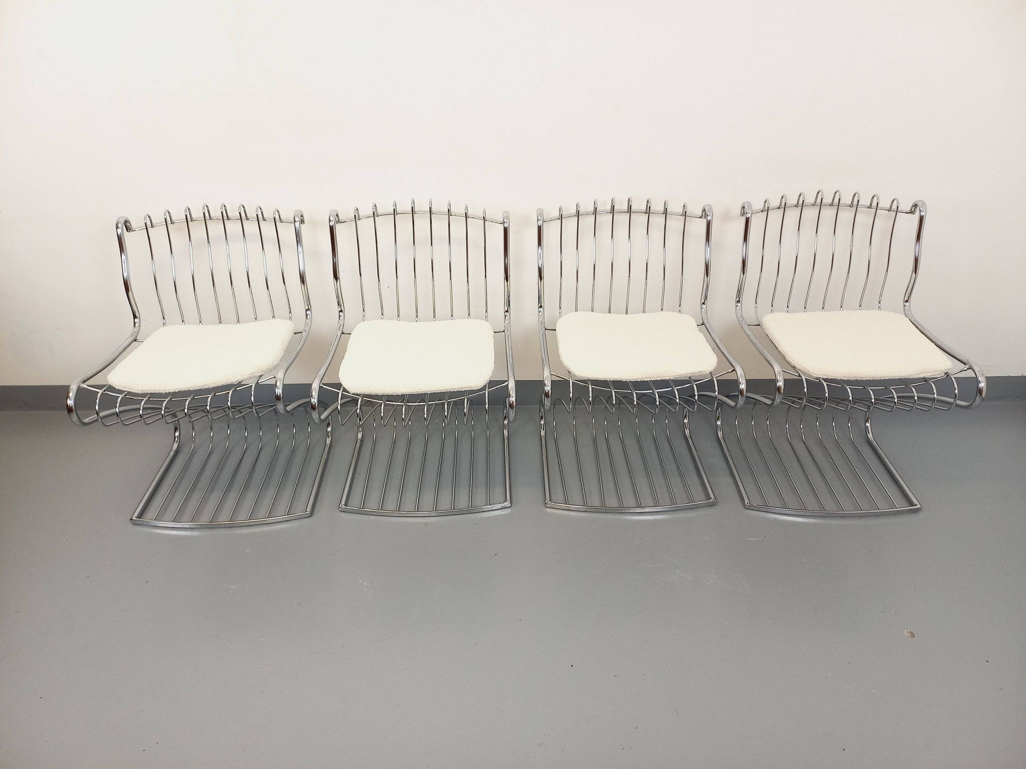 Set of 4 vintage Italian chairs by Gastone Rinaldi in chrome metal.