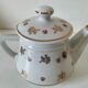 Porcelain teapot Louis Lourioux, decorated with roses and pyroluxe gilding.