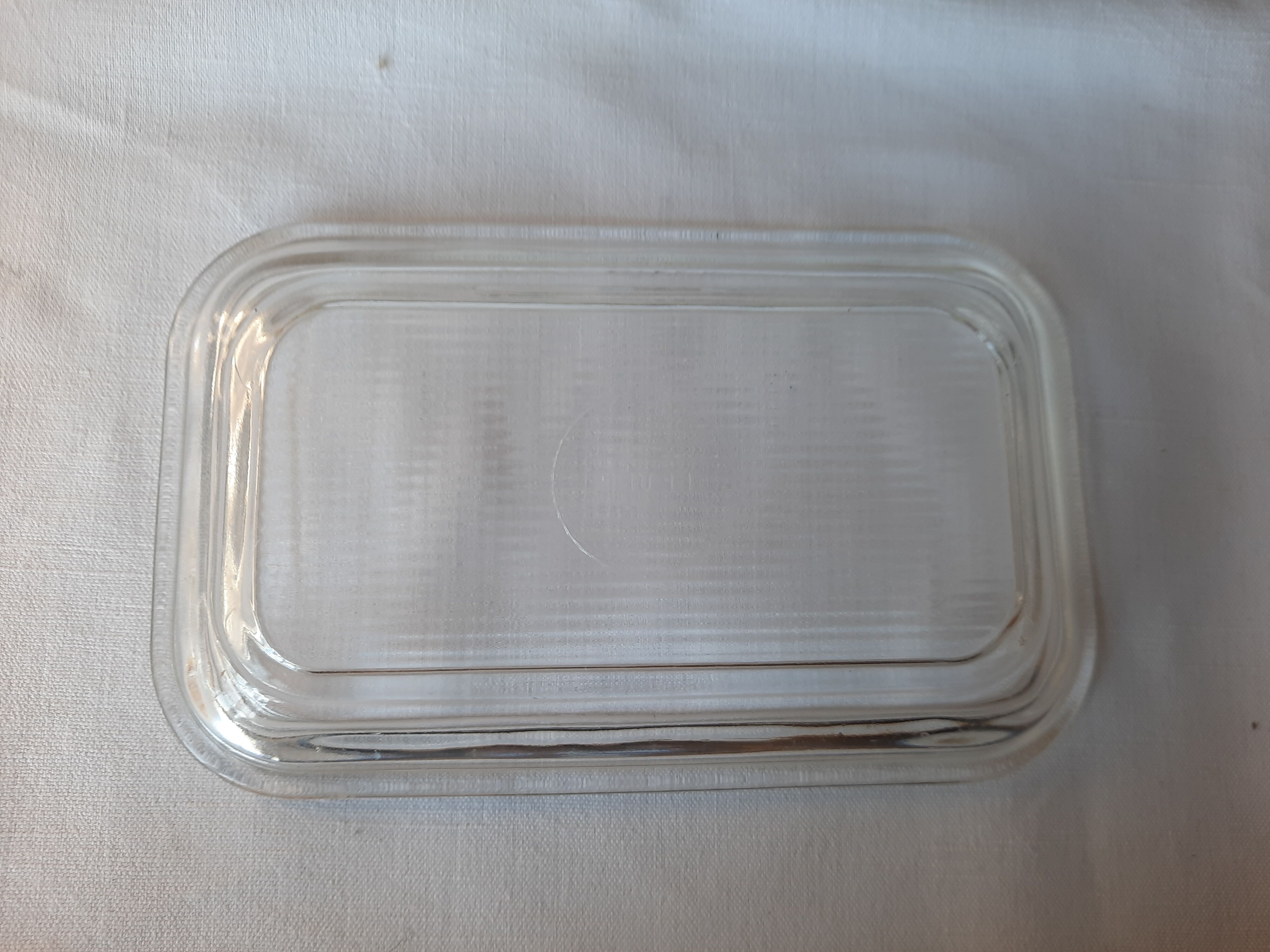 Transparent glass butter dish from lever