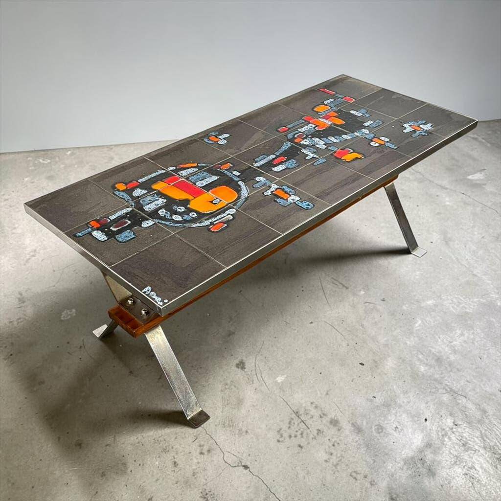 Vintage ceramic coffee table with chrome and wood accents.