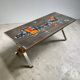 Vintage ceramic coffee table with chrome and wood accents.