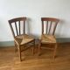 Set of 2 old mulched wooden chairs