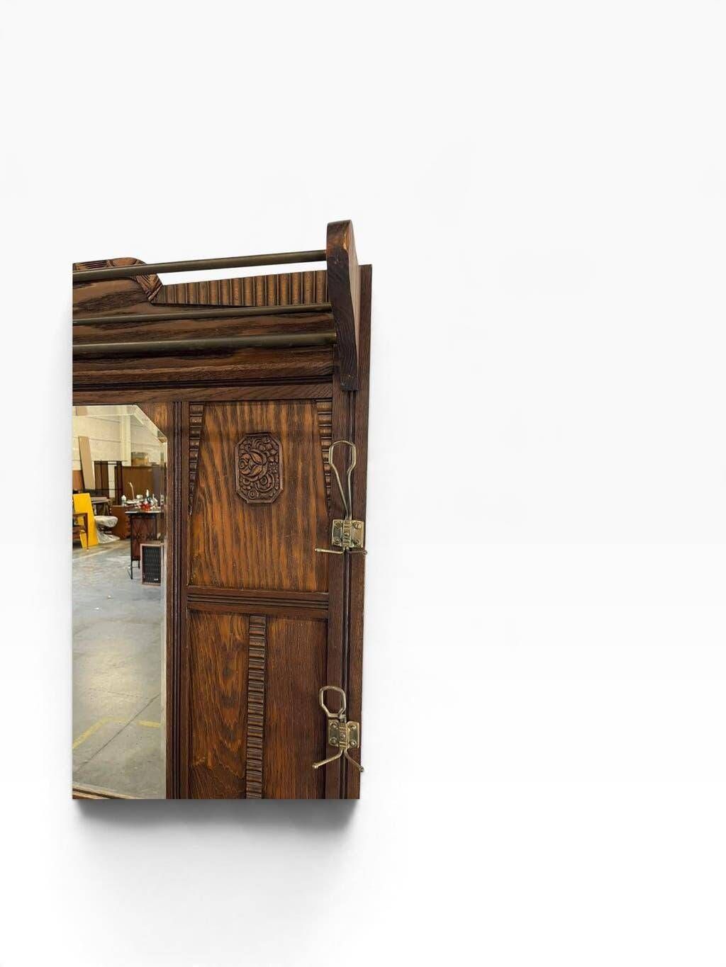 Vintage wooden coat rack with mirror.