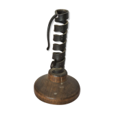 Candle holder with iron and wood pusher