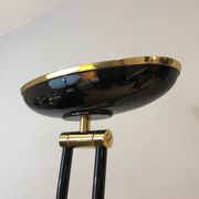 Black lacquered metal floor lamp with brass.
