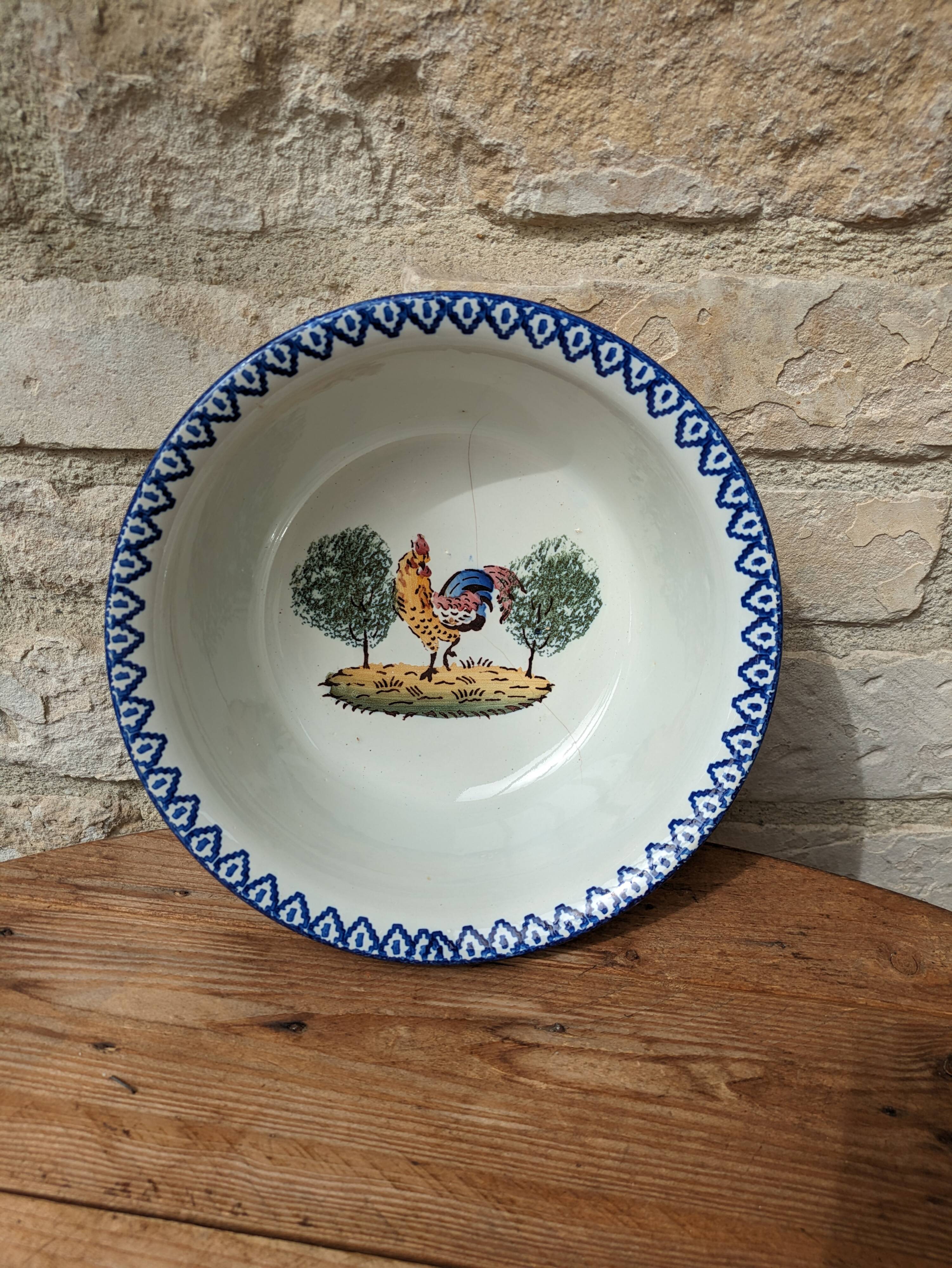 Old hollow serving dish with Saint Clément rooster motif France