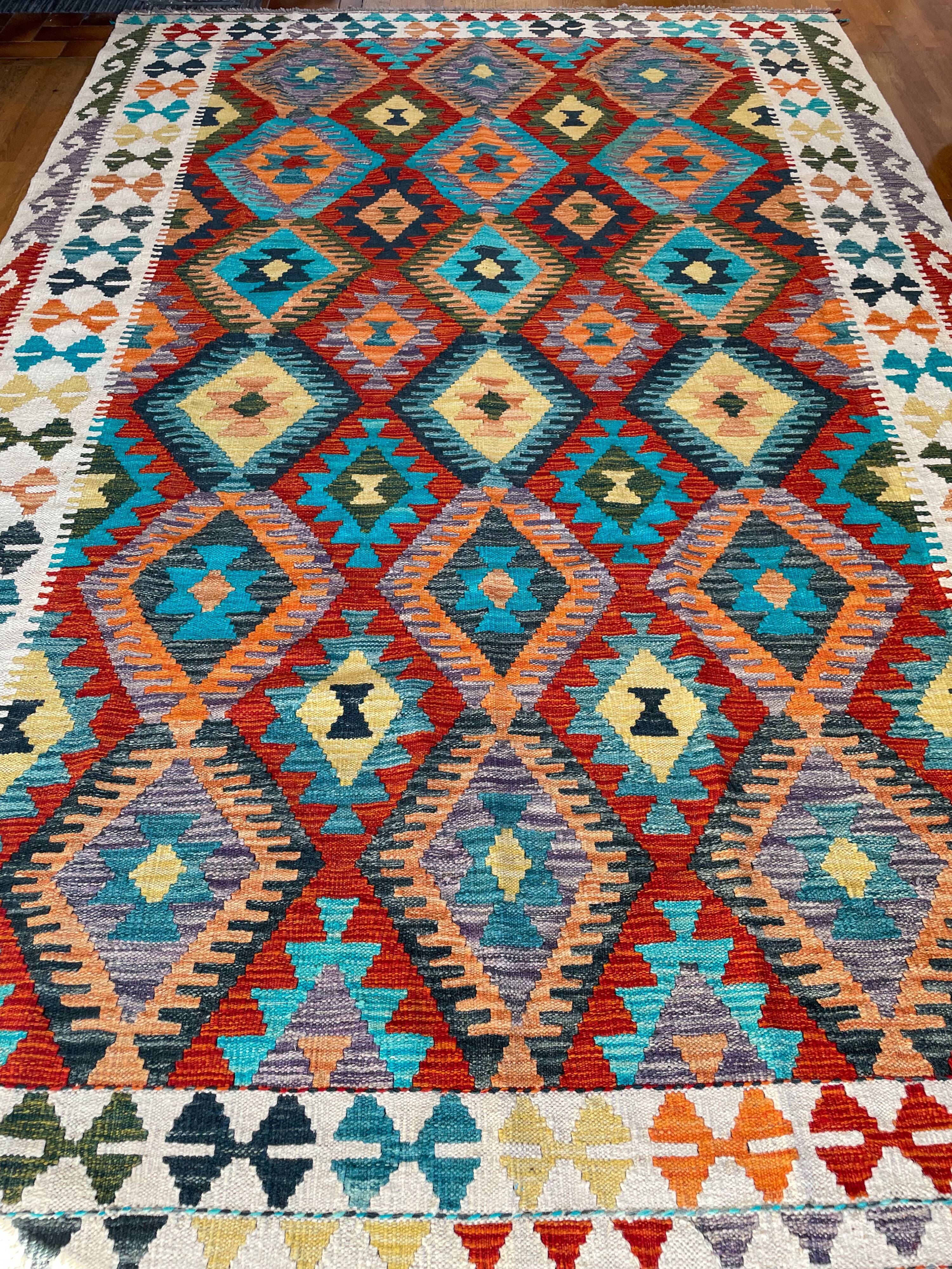 Oriental kilim rug afghan colored red and multicolored