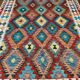 Oriental kilim rug afghan colored red and multicolored