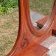 Art Deco oak dressing table, marble top and swivel mirror.