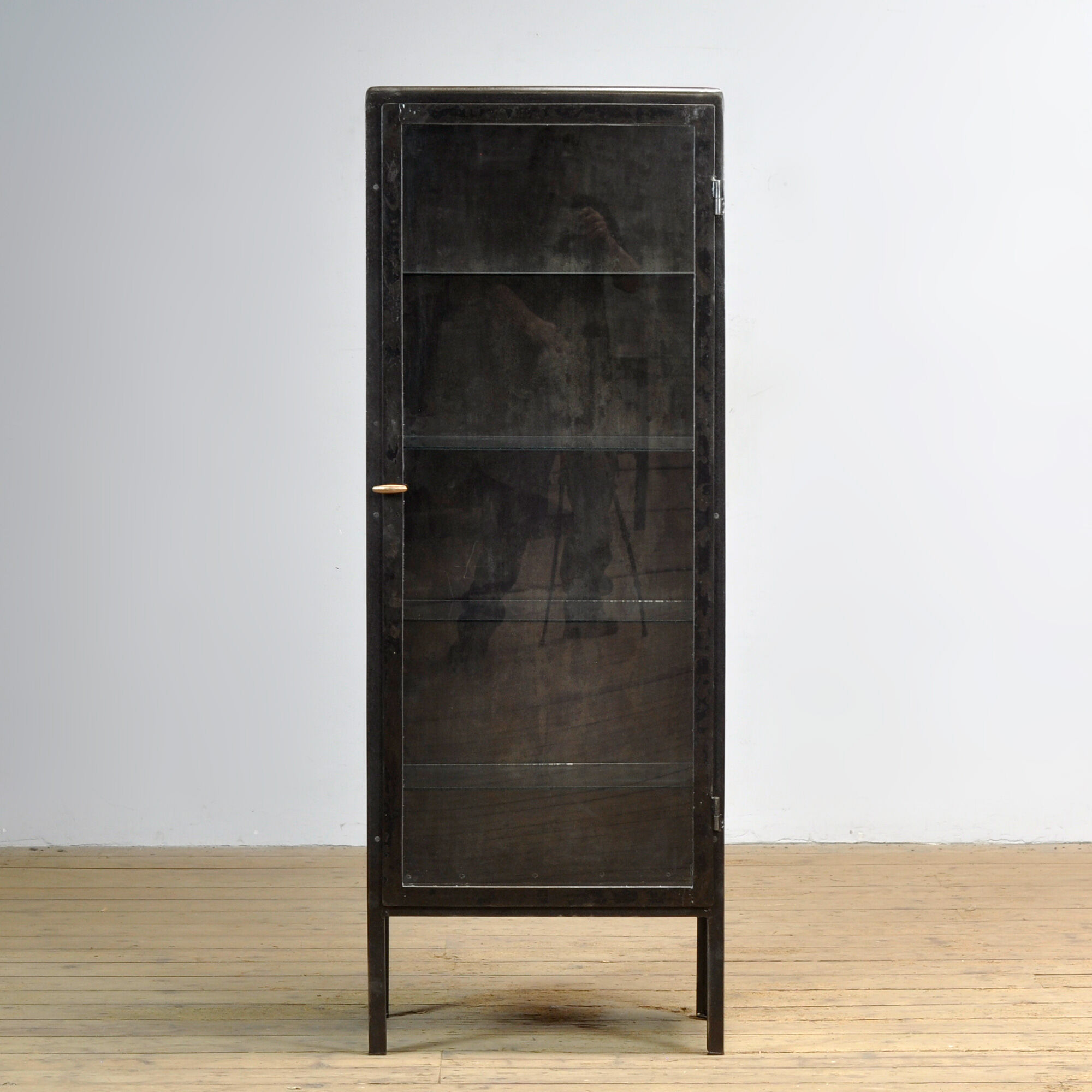 Polished iron medicine cabinet, 1920s