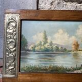 Pair of Art Deco wood and embossed metal landscape frames