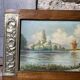 Pair of Art Deco wood and embossed metal landscape frames