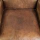 Sheepskin armchair in a light cognac colour with matching piping