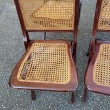 4 cane-seated solid wood folding chairs to be repaired.