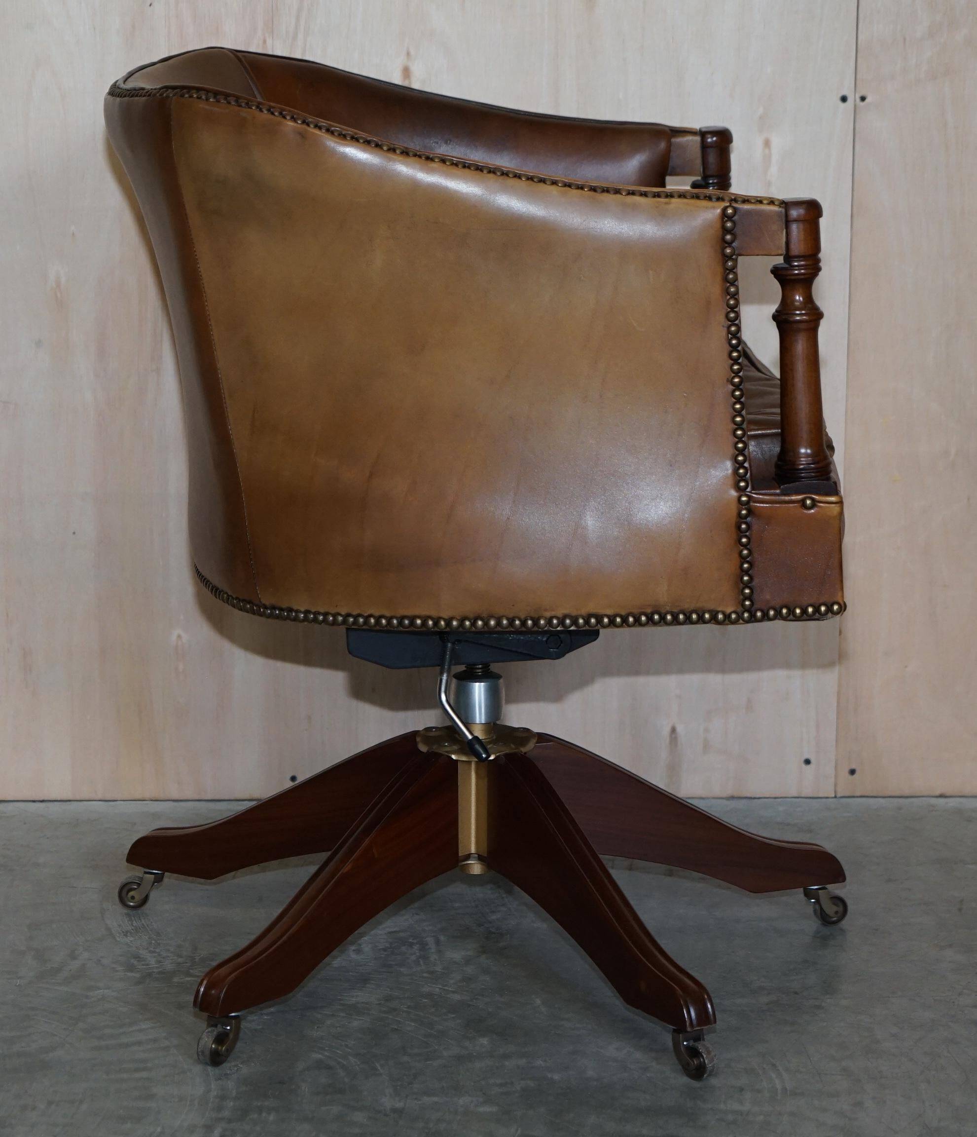 Vintage Patinated Leather Chesterfield Swivel Captain's Armchair